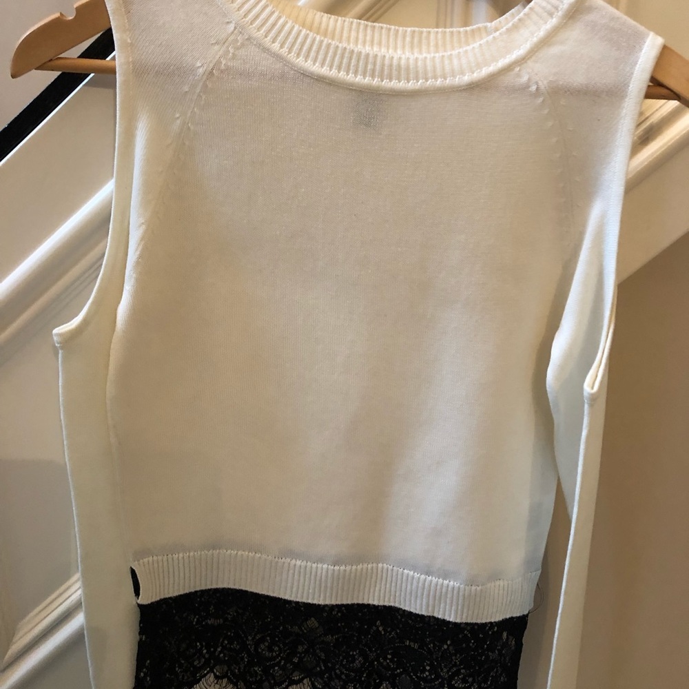Ivory cold shoulder sweater with black lace trim